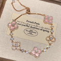 Adjustable Rose Gold Clover Bracelet with Sparkling Floral