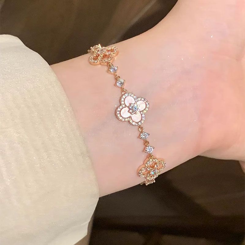 Adjustable Rose Gold Clover Bracelet with Sparkling Floral