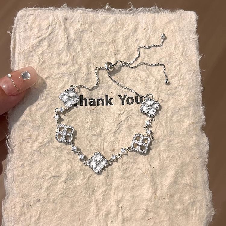 Adjustable Silver Clover Bracelet with Sparkling Floral