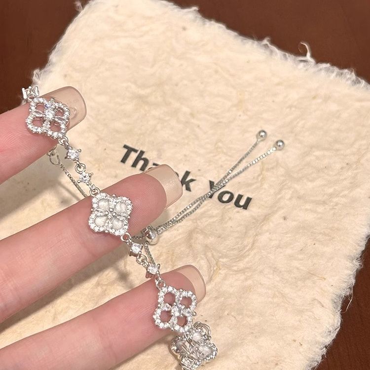Adjustable Silver Clover Bracelet with Sparkling Floral