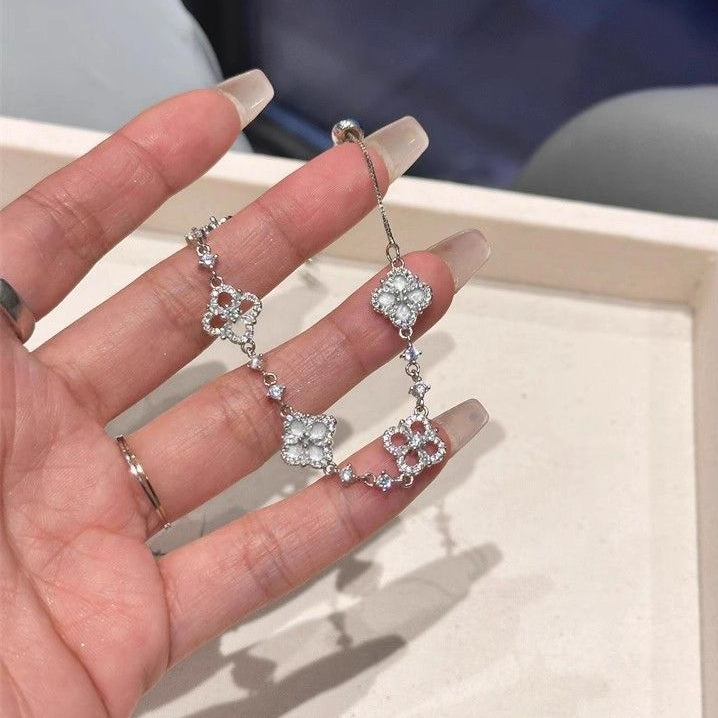 Adjustable Silver Clover Bracelet with Sparkling Floral