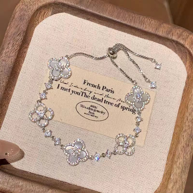 Adjustable Silver Clover Bracelet with Sparkling Floral