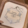 Adjustable Silver Clover Bracelet with Sparkling Floral