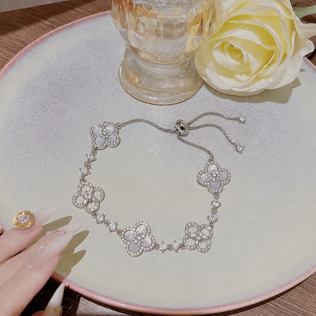 Adjustable Silver Clover Bracelet with Sparkling Floral